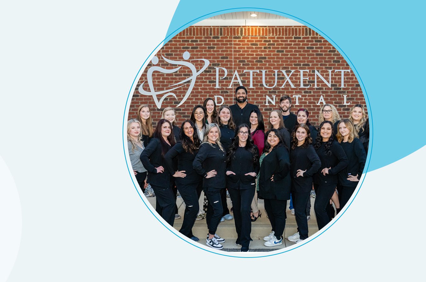 A group of people in black shirts and pants.